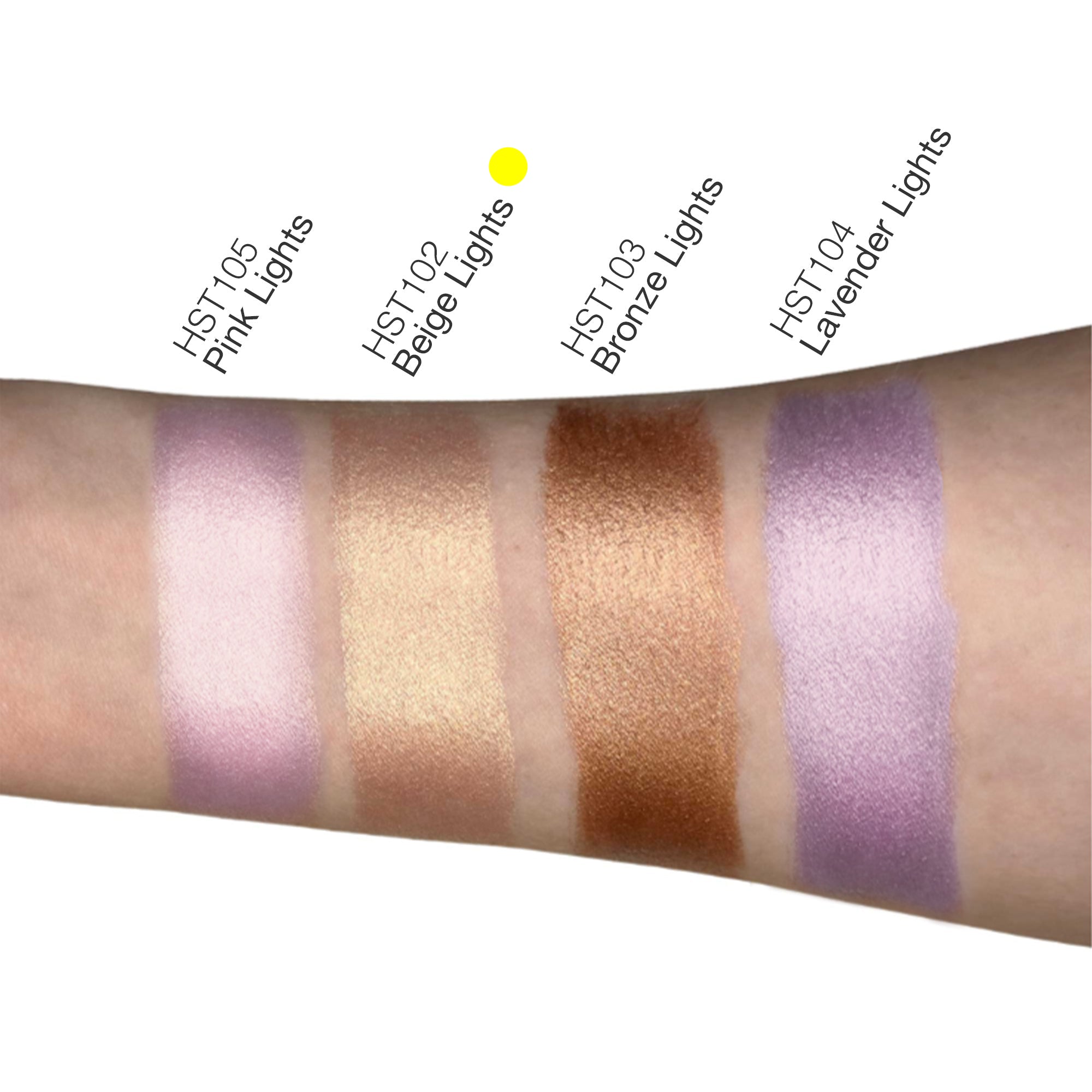 Beige highlighter swatch on toned arm showing shimmer effect