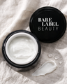 Bare Label Beauty Active Eye Cream – lightweight moisturizer in open jar with swatch on linen surface