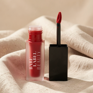 Bare Label Beauty Matte Lip Stain in Velvet Red – open tube with applicator on linen background
